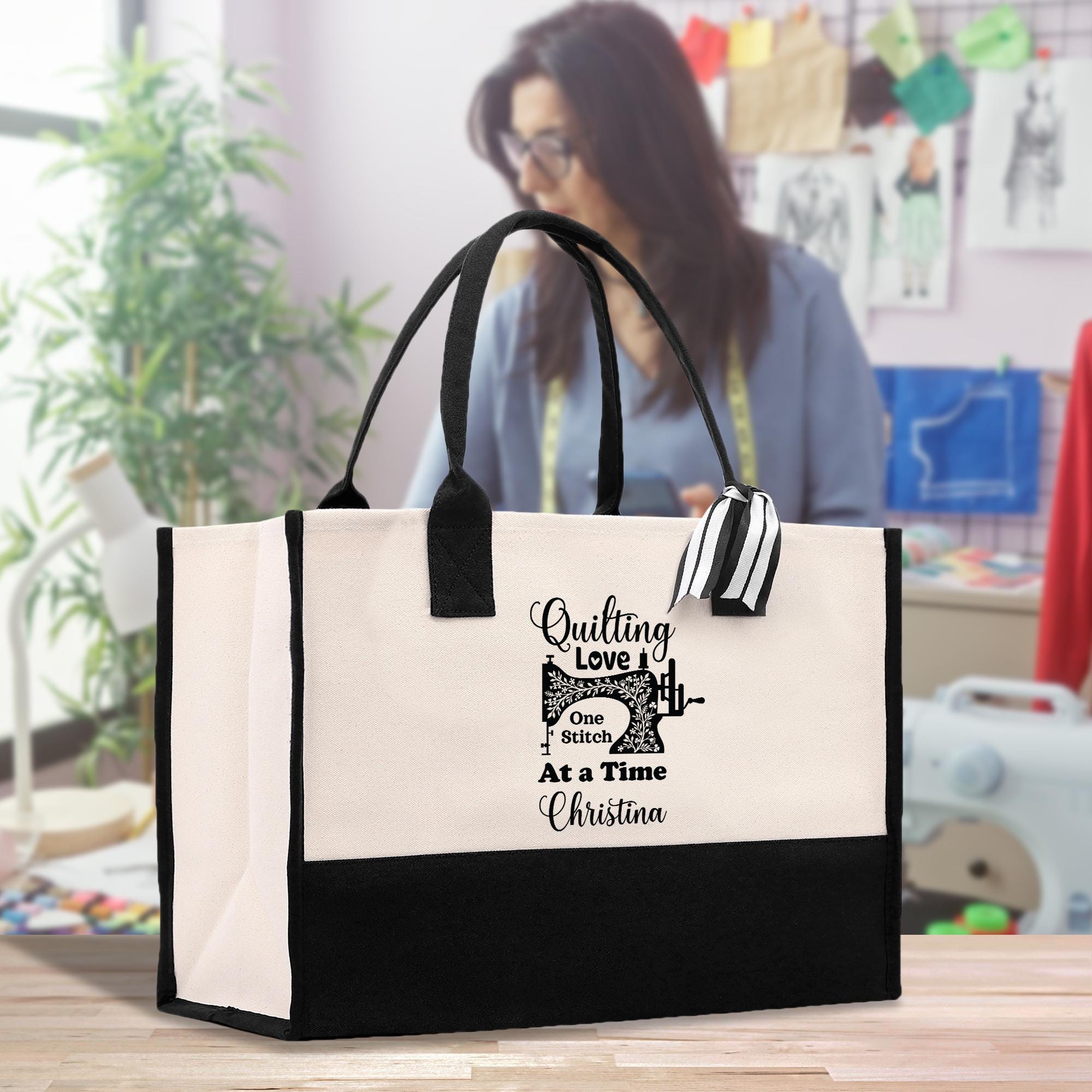 a woman holding a black and white shopping bag