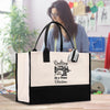 a woman holding a black and white shopping bag