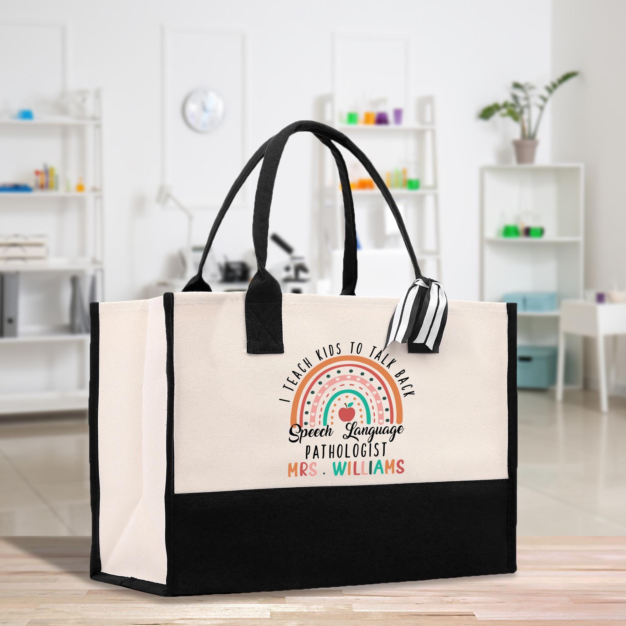 a black and white bag with a rainbow on it