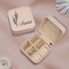 a small white box with jewelry inside of it