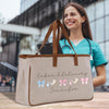 a woman holding a bag with a name on it