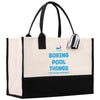 a black and white shopping bag with a striped handle
