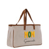 A beige canvas tote bag with the text "MOM Savannah" printed on it in yellow and green letters.