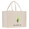 a white shopping bag with a picture of a flower
