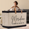 A beige tote bag with black trim and leather handles, featuring the name "Meridian" printed on it.