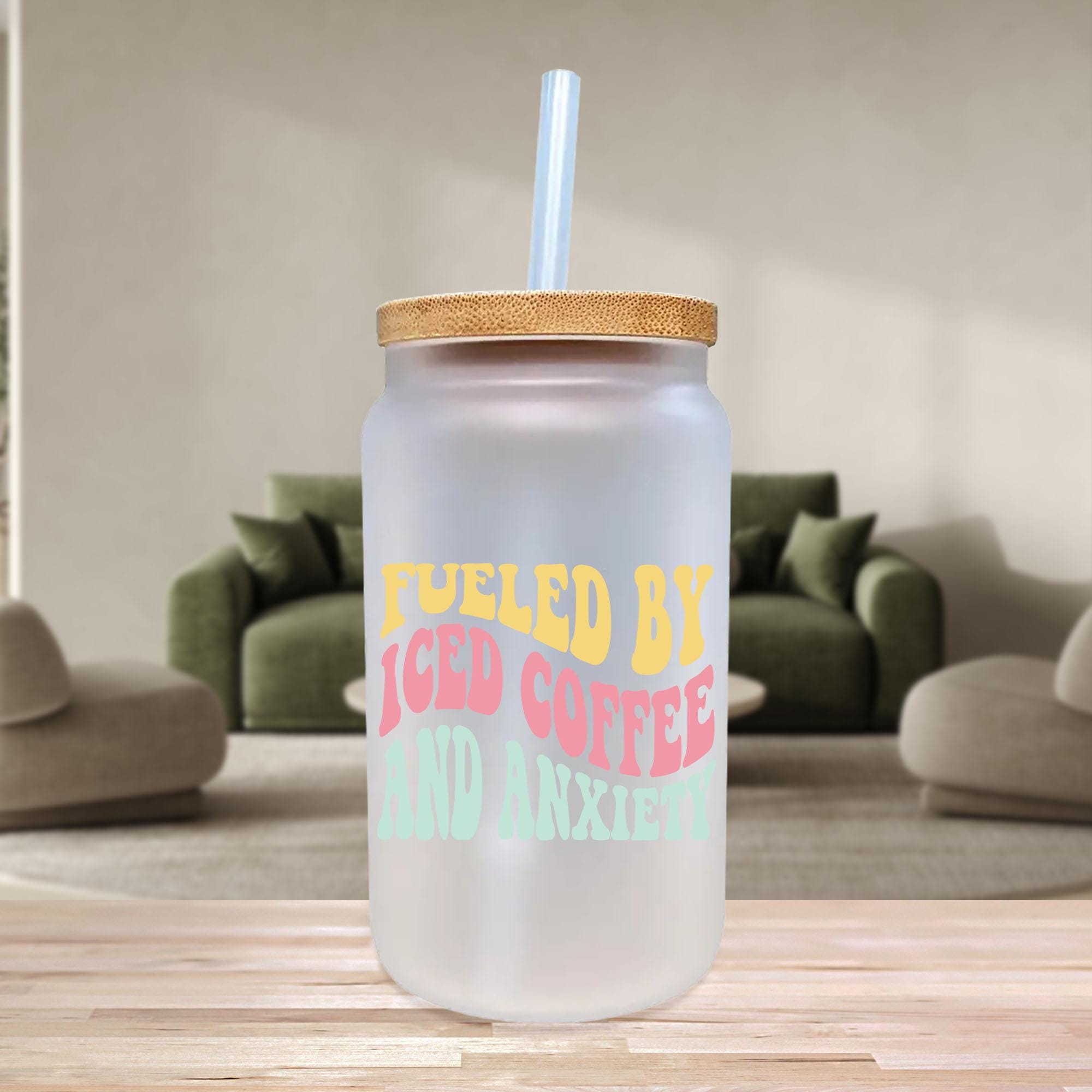 a glass with a straw in it sitting on a table