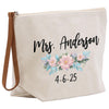 a white canvas bag with a floral design on it