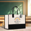 a black and white bag with a rainbow on it