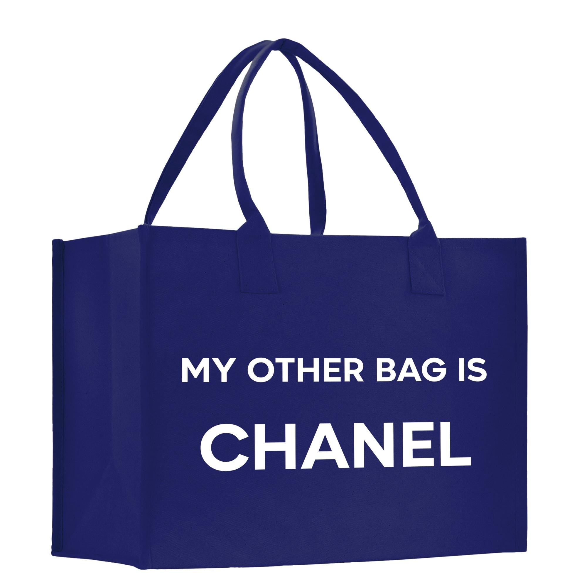 a blue shopping bag that says, my other bag is chanel