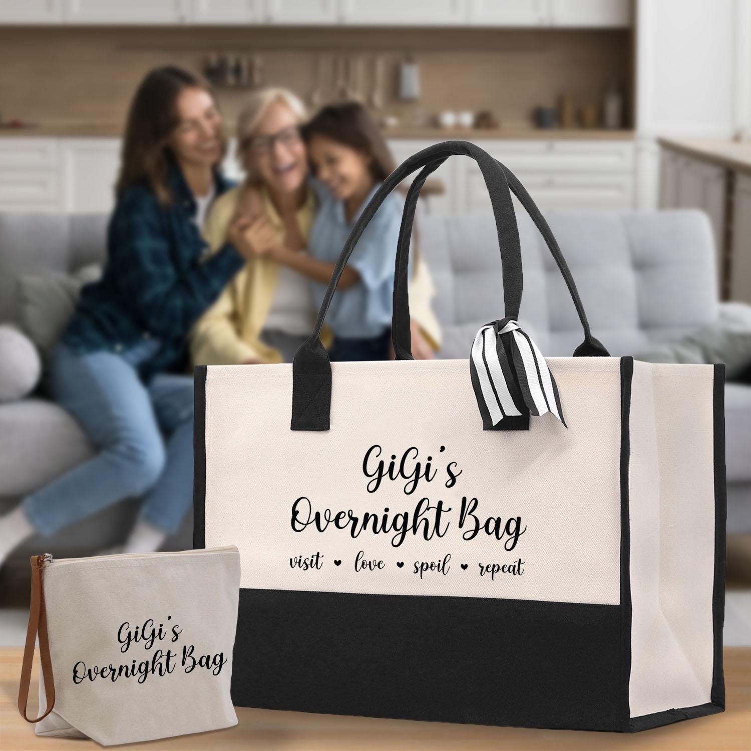 two women sitting on a couch with a large bag