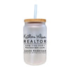 a white mason jar with a straw in it