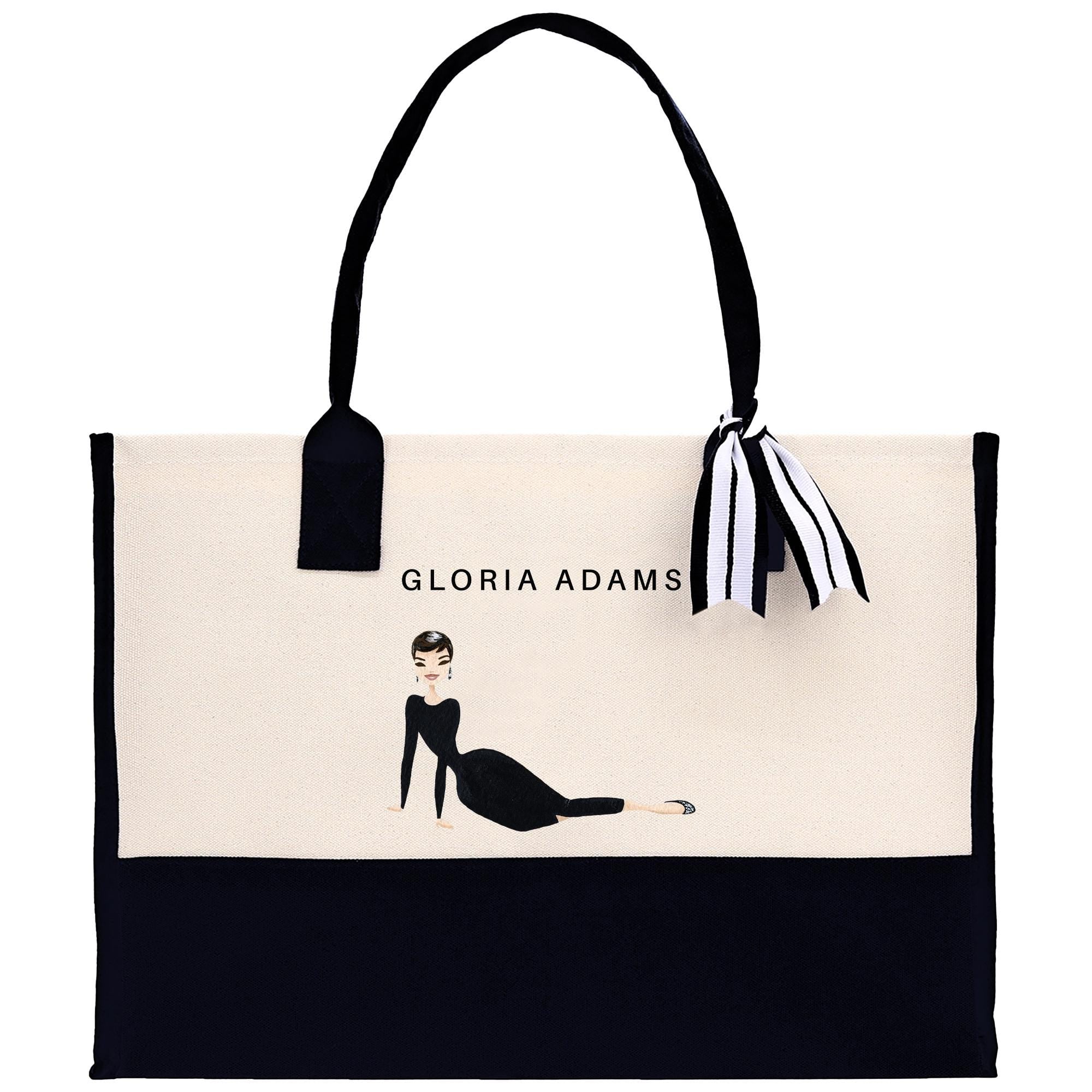 a black and white bag with a picture of a woman on it