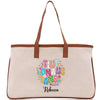 A beige canvas tote bag with a personalized name printed on it.