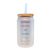 a glass jar with a straw in it