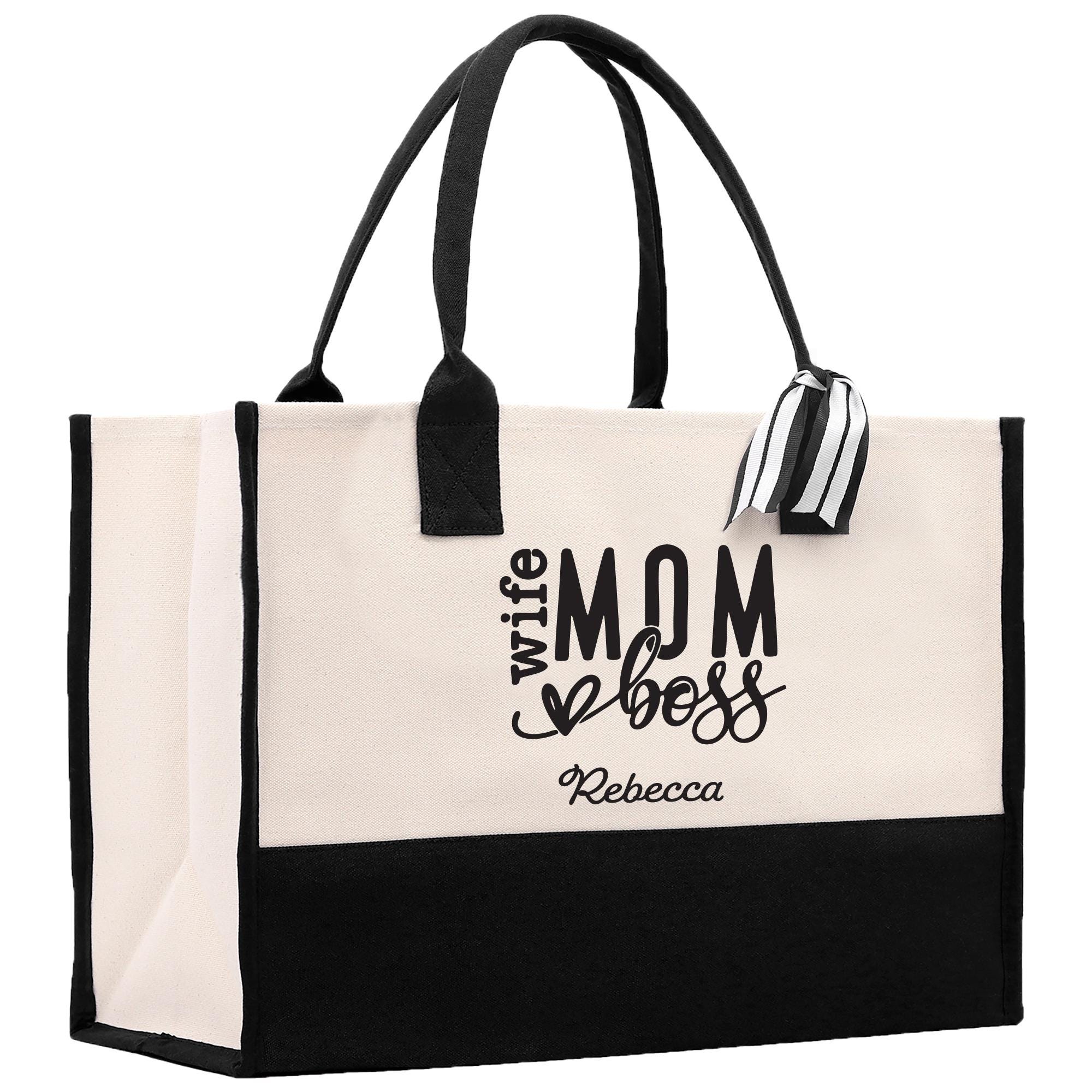 a white and black bag with a black handle