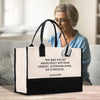 a woman sitting on a couch holding a bag