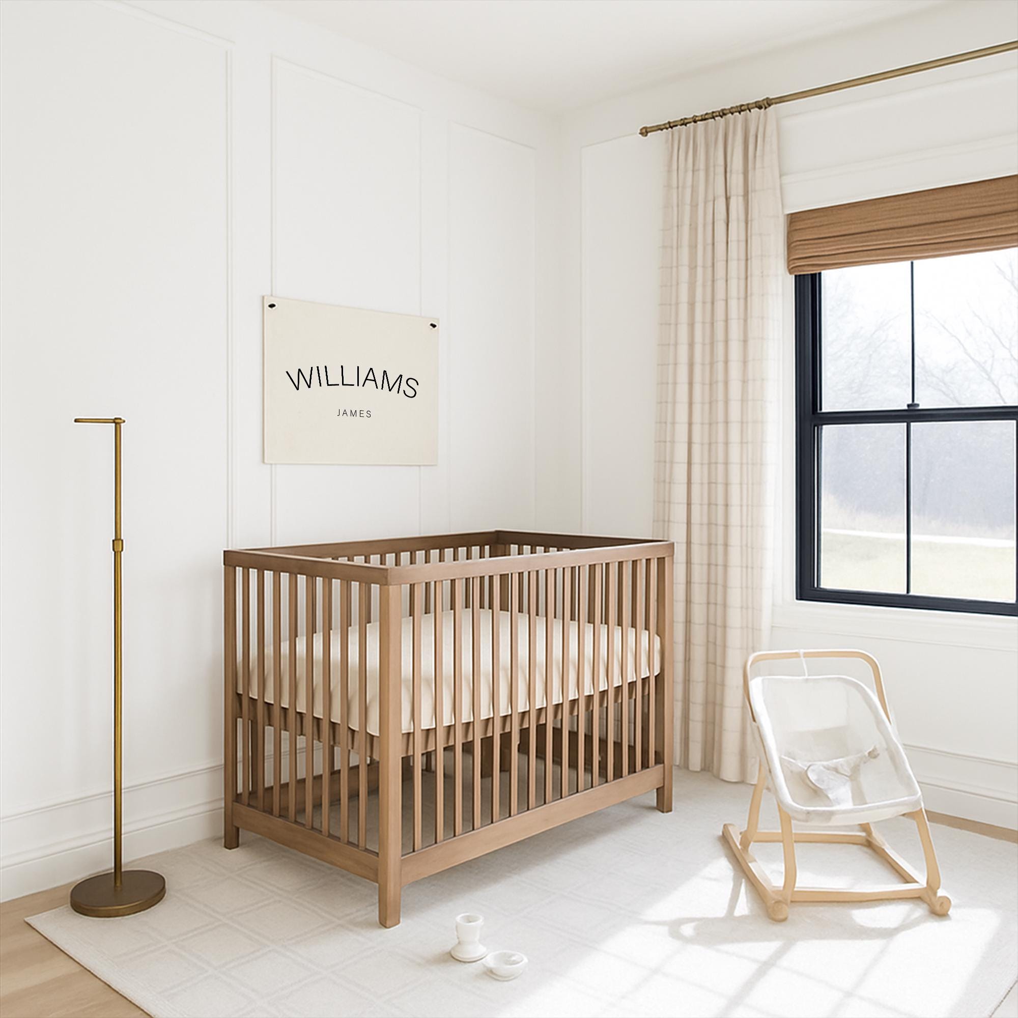 A wooden crib with a white mattress sits in a bright, white nursery room with a window and a wooden rocking chair.