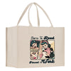 a white shopping bag with a picture of a woman reading a book