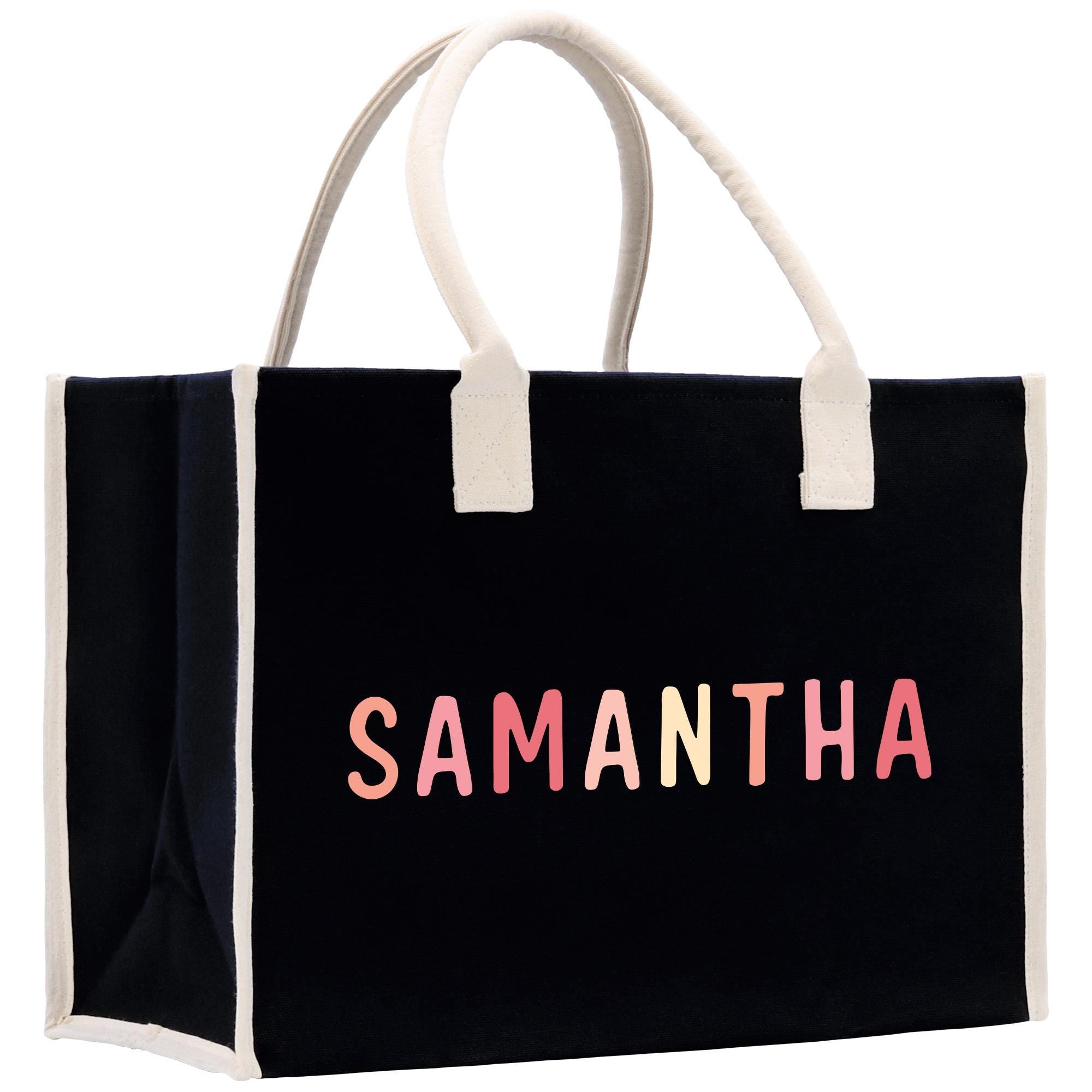 a black shopping bag with the word samantaha printed on it