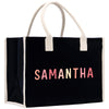 a black shopping bag with the word samantaha printed on it