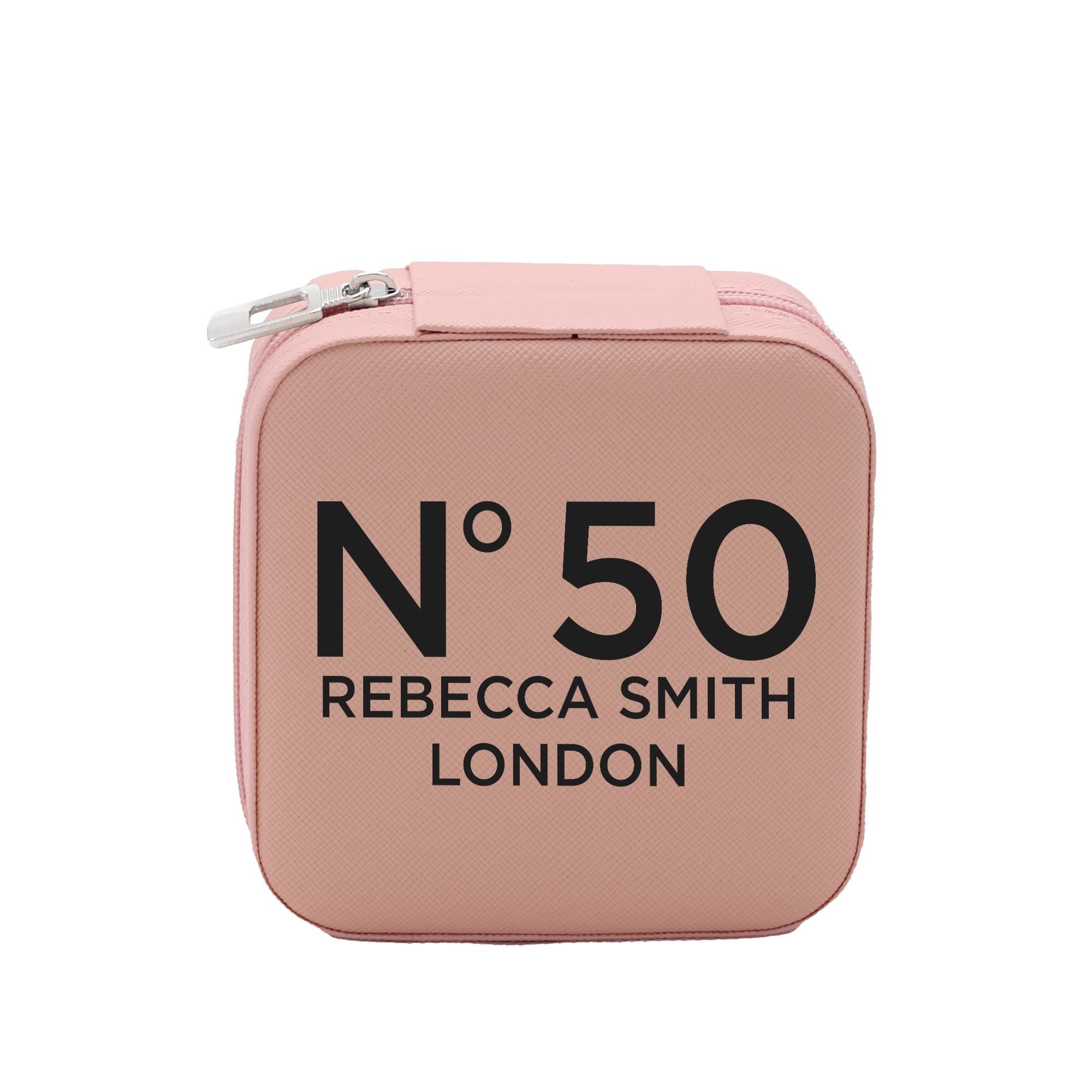 A pink makeup bag with the text "N50 Rebecca Smith London" printed on it.