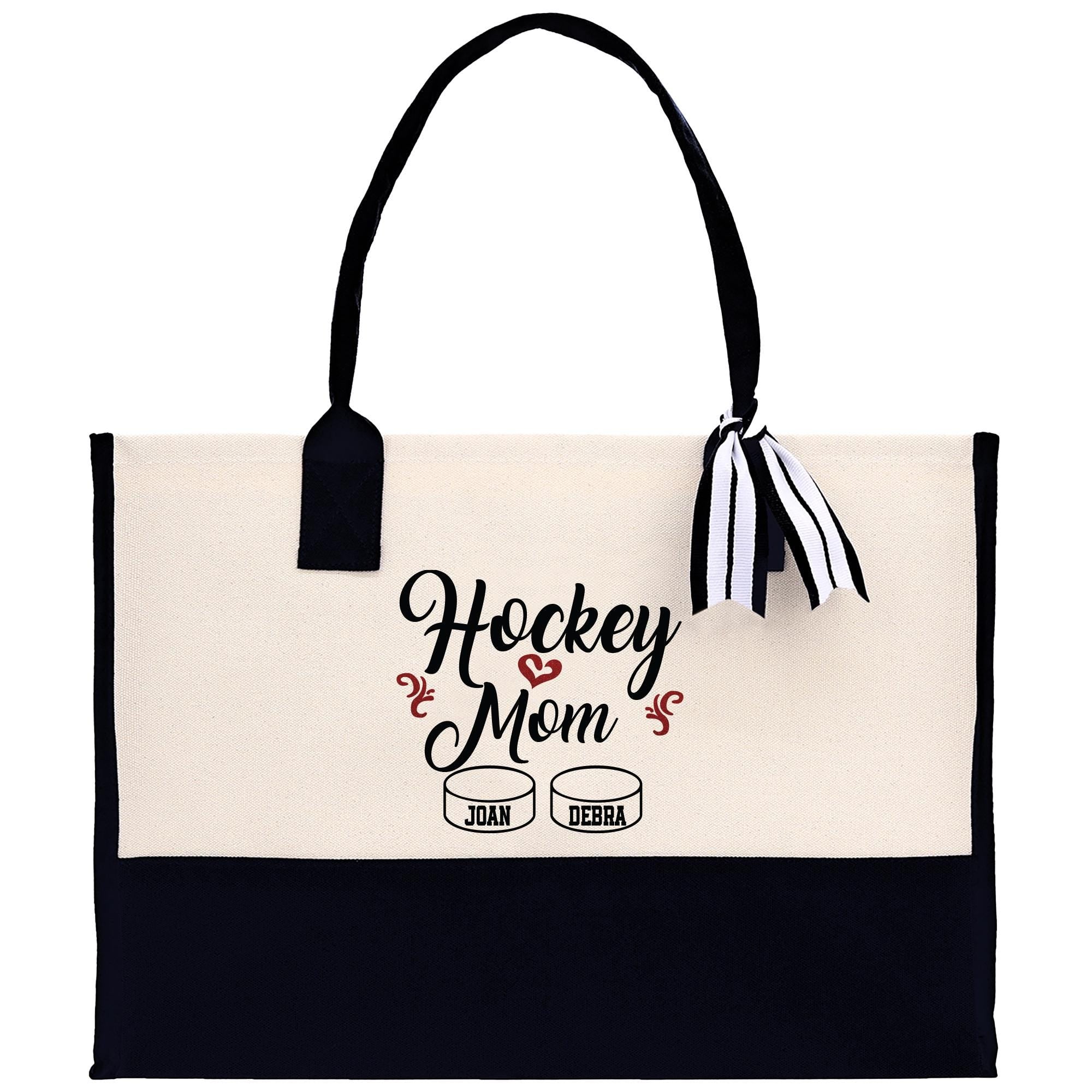 a black and white tote bag with the words hockey mom on it