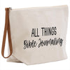 a white canvas bag with a brown leather strap that says all things bible journaling