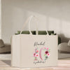 a white bag with a floral design on it
