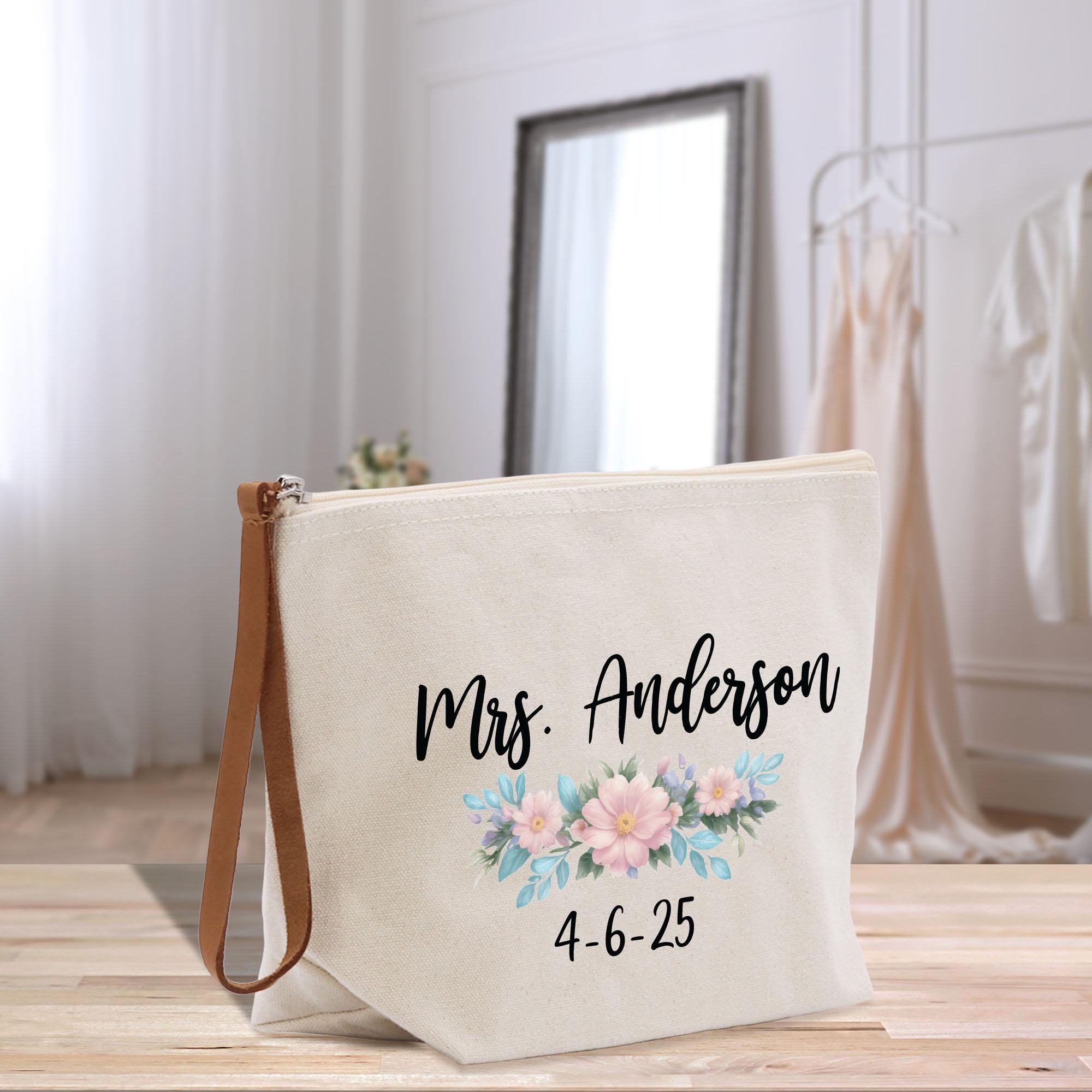 a white bag with a floral design on it