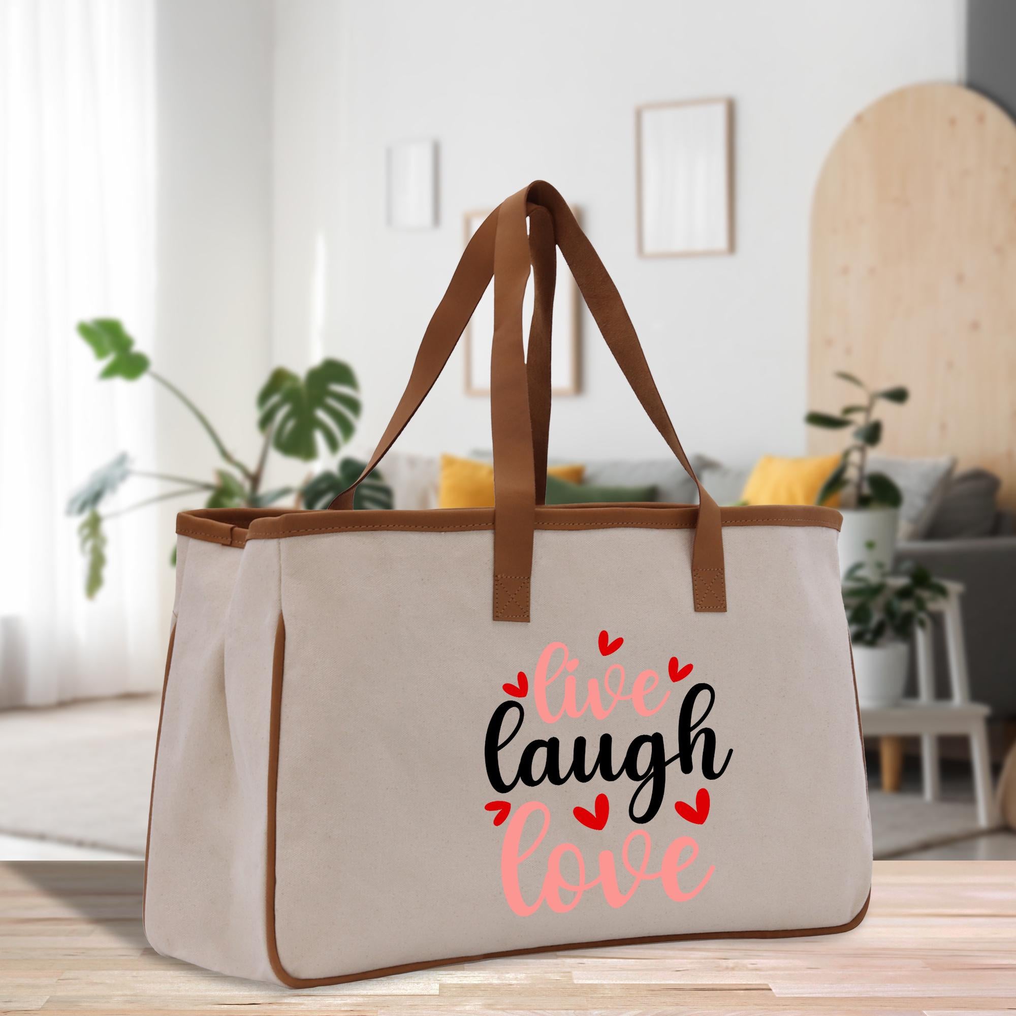 a canvas bag with the words live laugh love printed on it