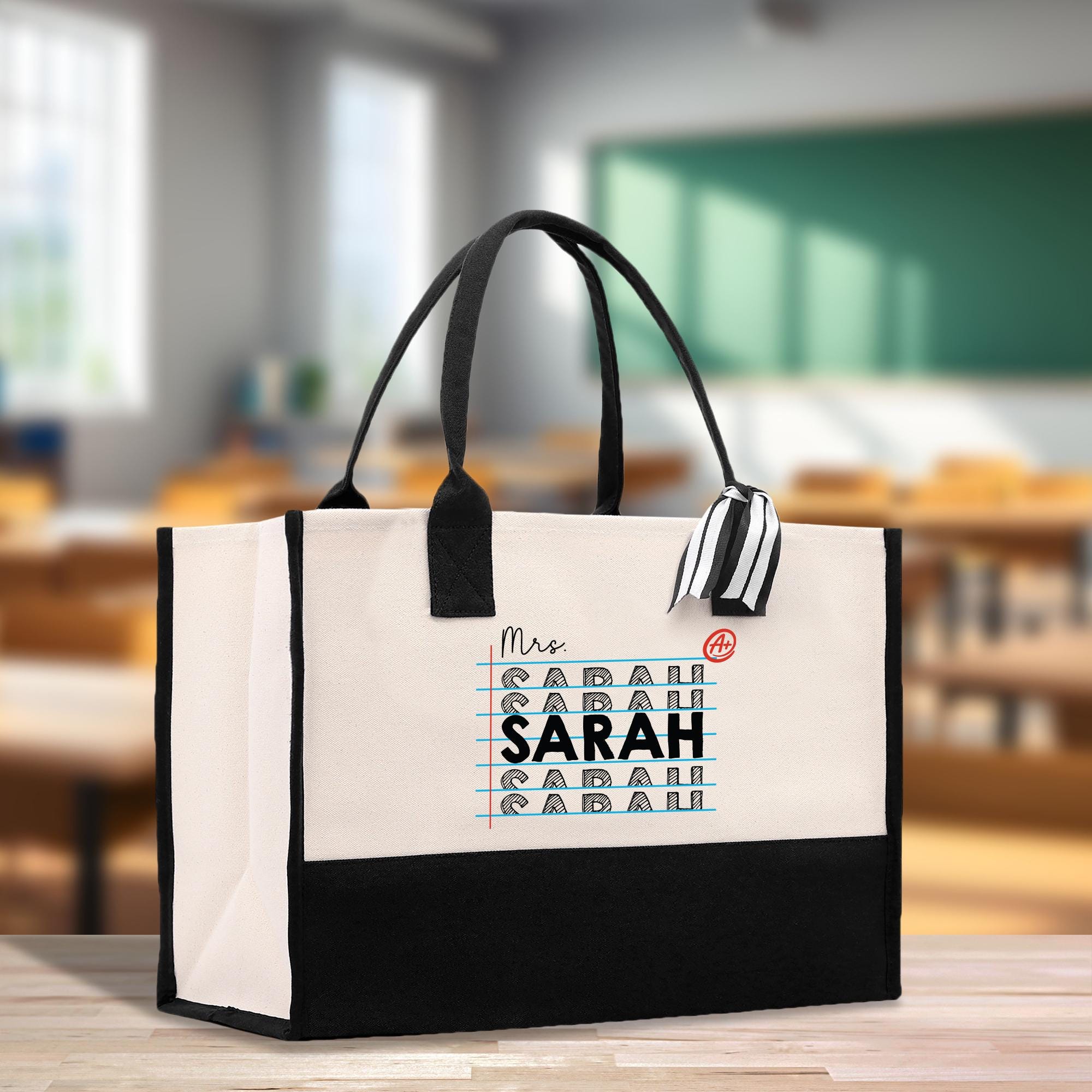 a white and black bag with a black handle