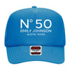 A blue trucker hat with the text "N°50 EMILY JOHNSON AUSTIN, TEXAS" printed on it.