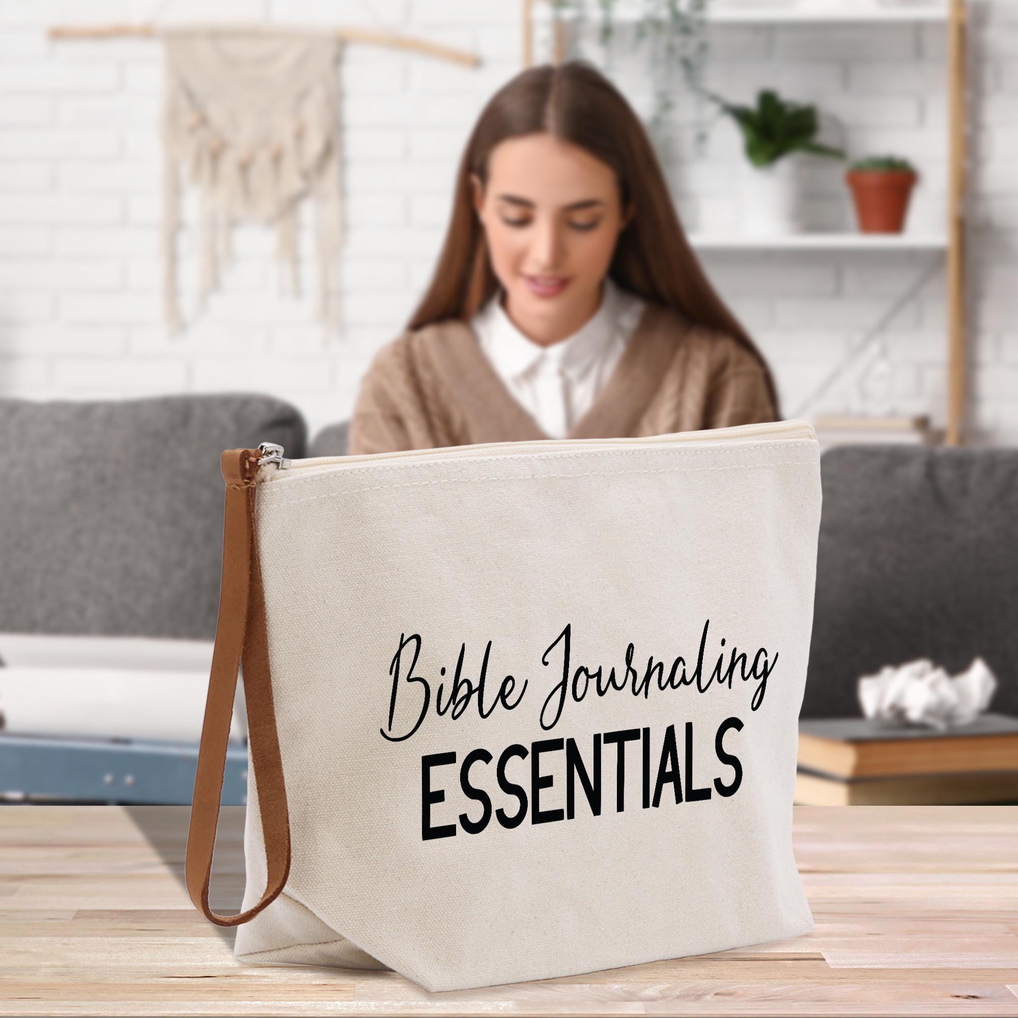 a woman sitting at a table with a bag on it