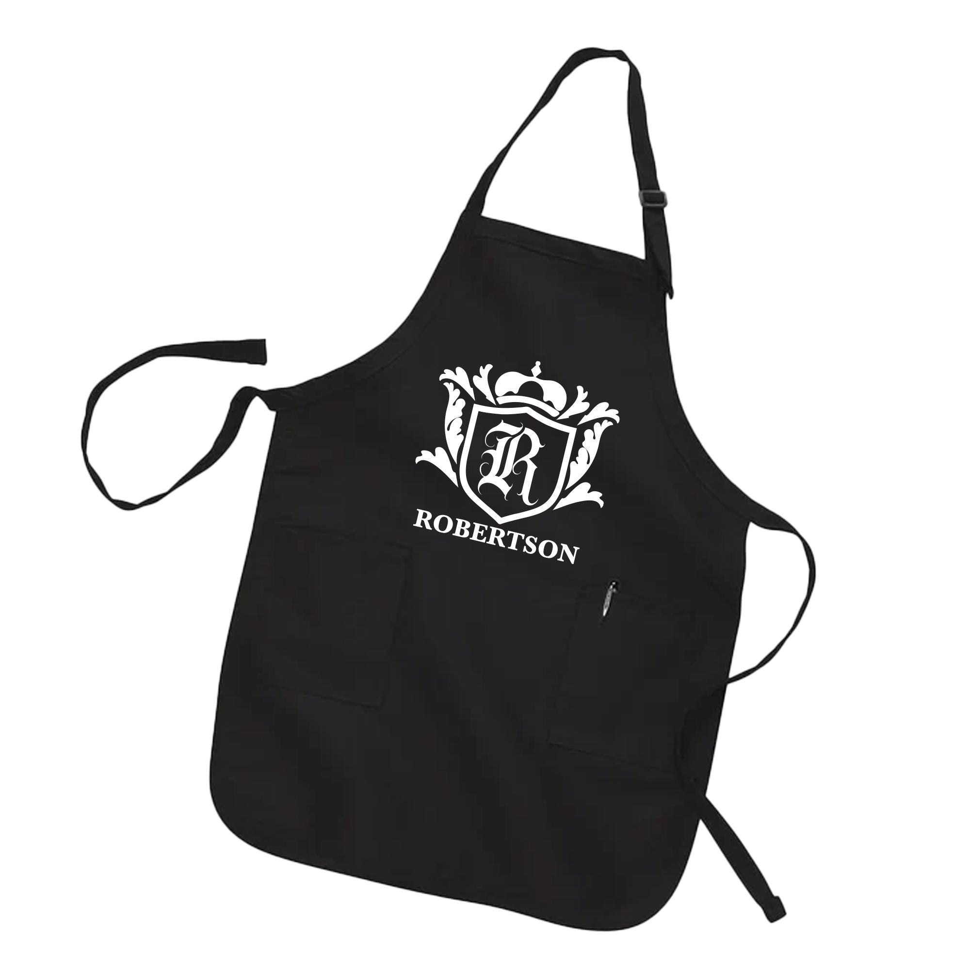 A black apron with a white crest and the name &quot;ROBERTSON&quot; printed on it.