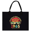 a black tote bag with a vintage logo