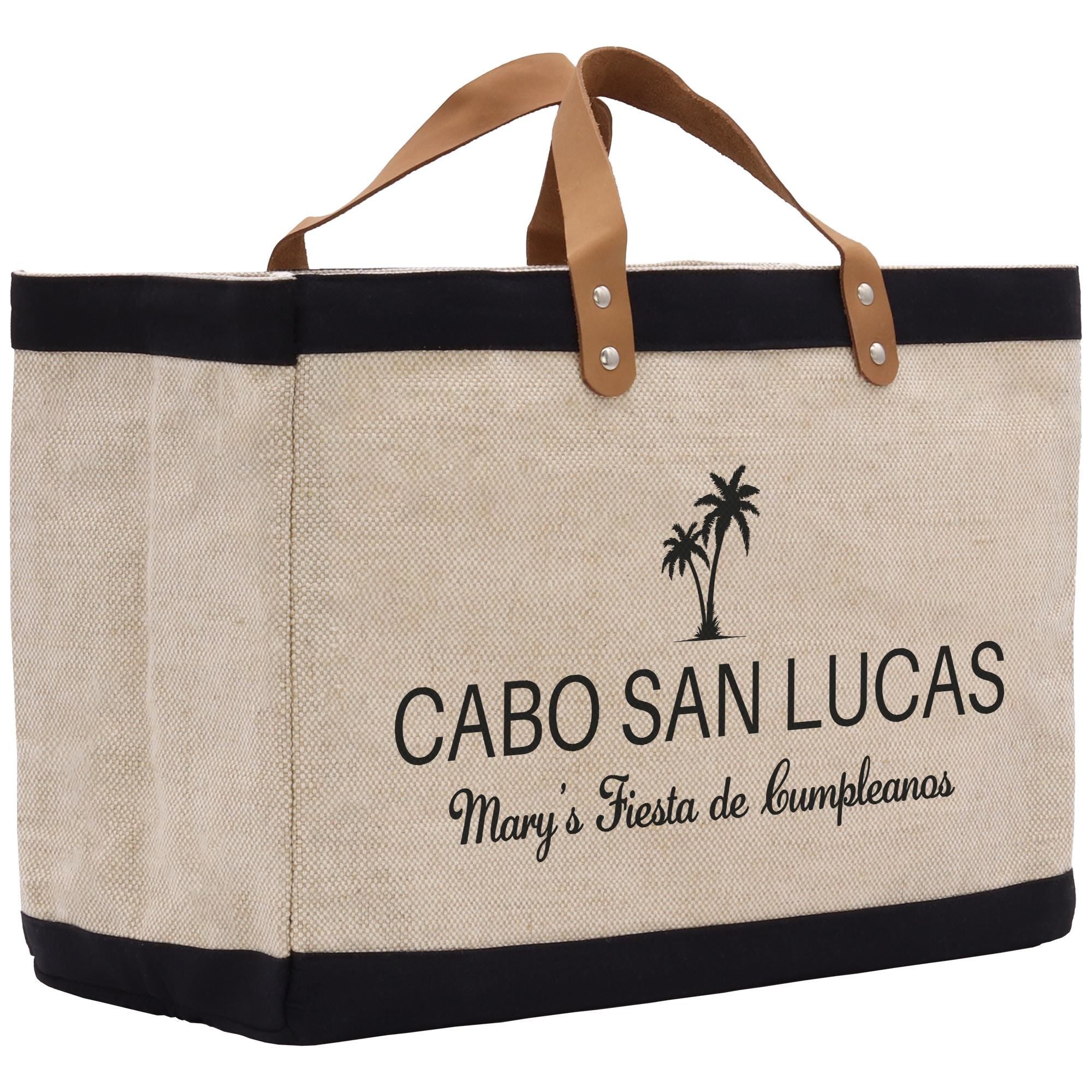 a canvas tote bag with a leather handle