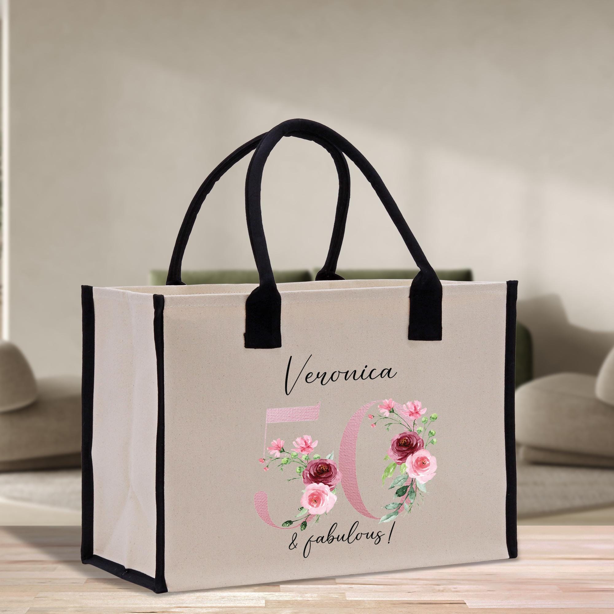 a white bag with pink flowers on it