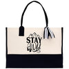 A black and white tote bag with the text 