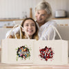 a woman and a girl are looking at a shopping bag