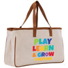 a canvas tote bag with a play learn and grow message