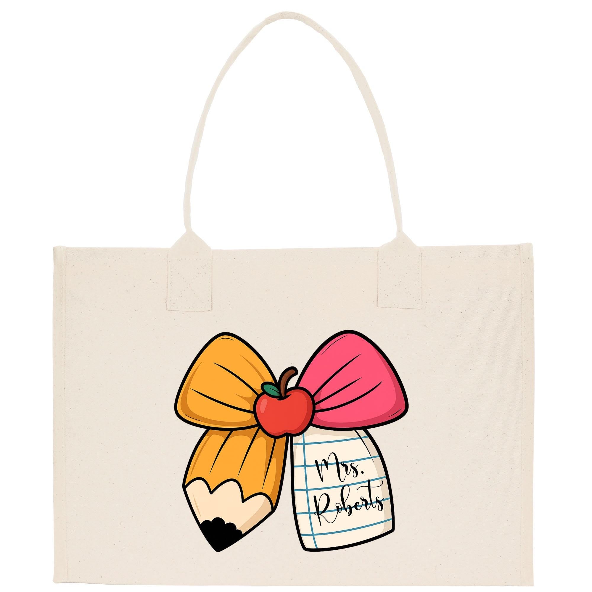A beige canvas tote bag with a cartoon illustration of a pencil and a bow, along with a tag that says &quot;Mrs. Roberts&quot;.