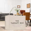 a white bag sitting on top of a wooden floor
