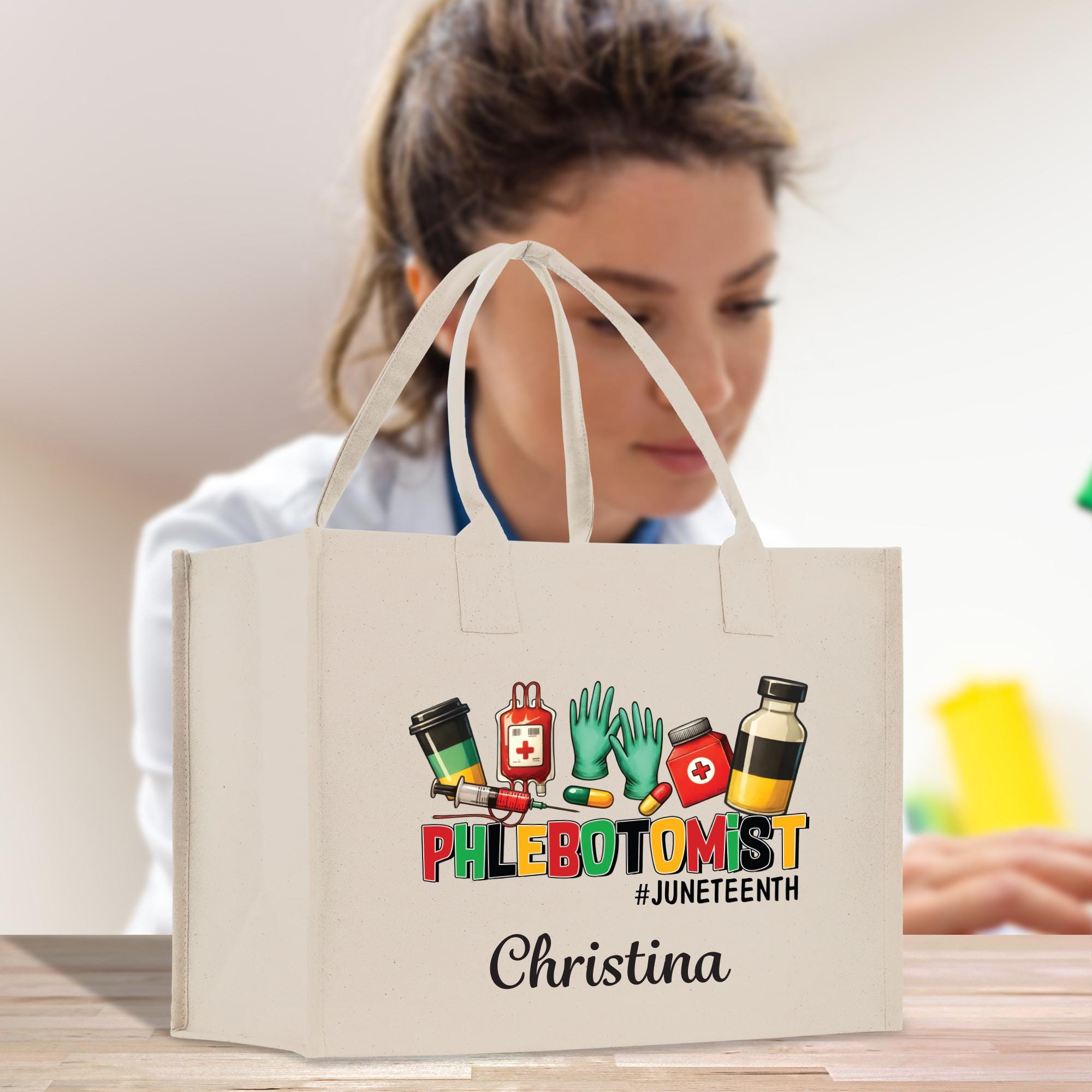 a woman holding a shopping bag with a phlebotomit logo on it