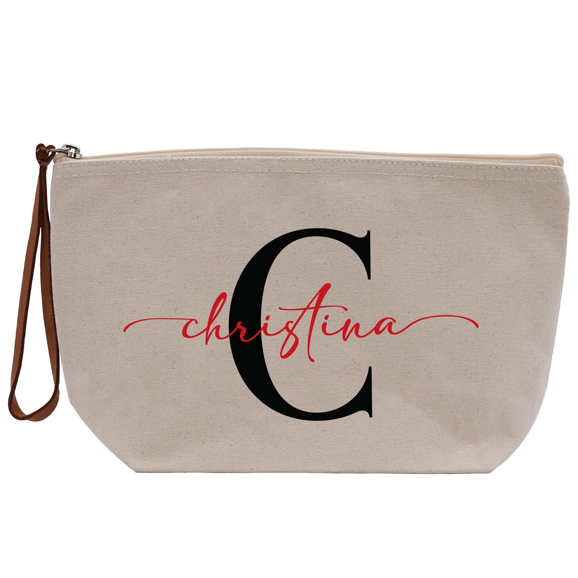 a white cosmetic bag with the letter c on it