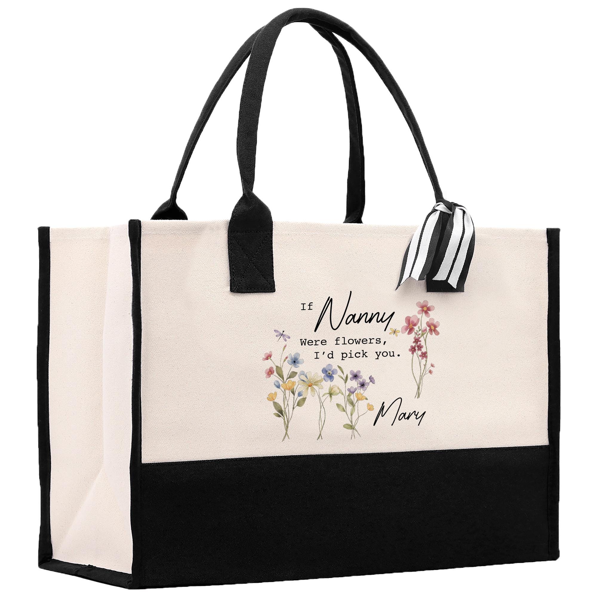 a black and white bag with flowers on it