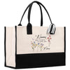 a black and white bag with flowers on it