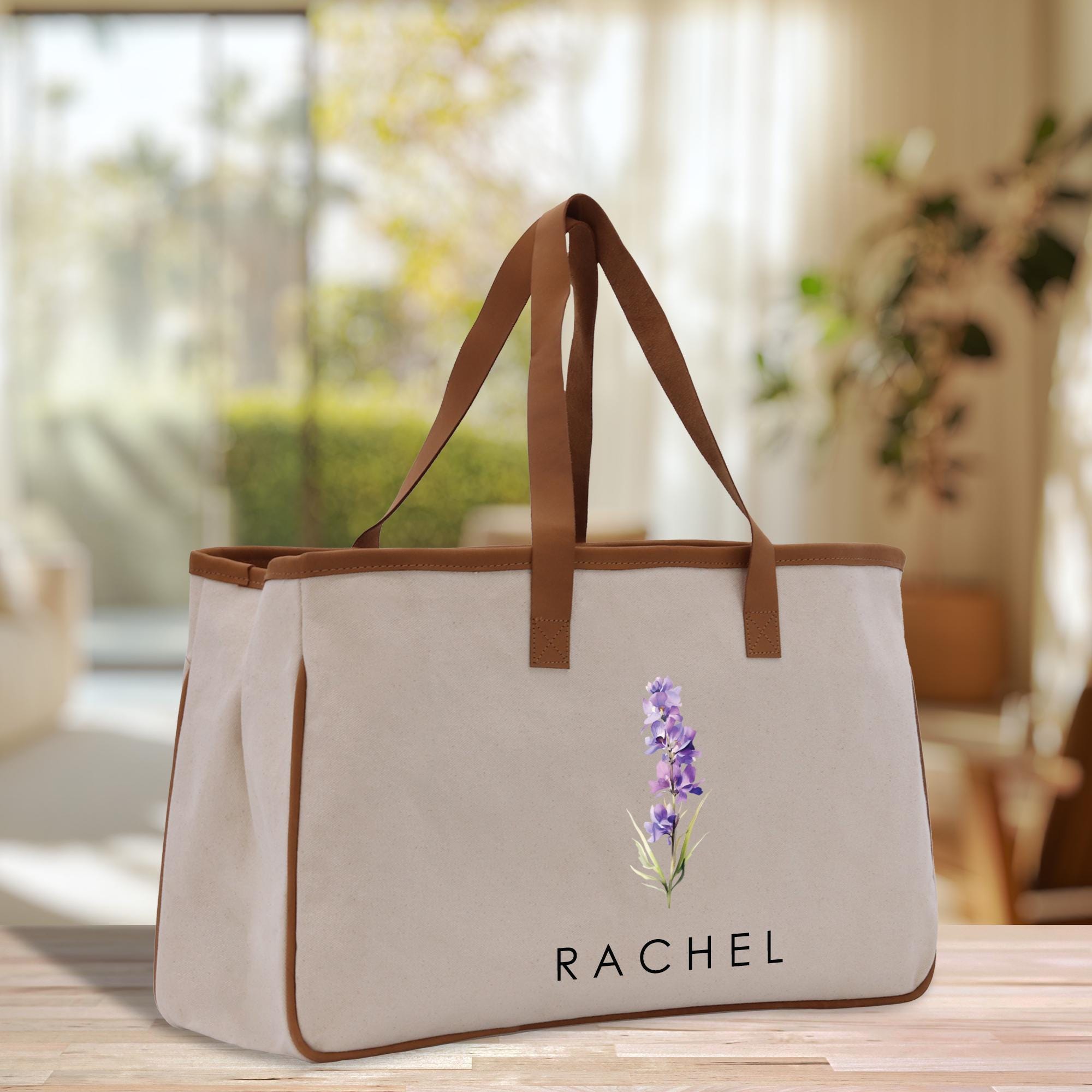 a white bag with a purple flower on it