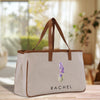 a white bag with a purple flower on it