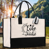 A black and white tote bag with the text 