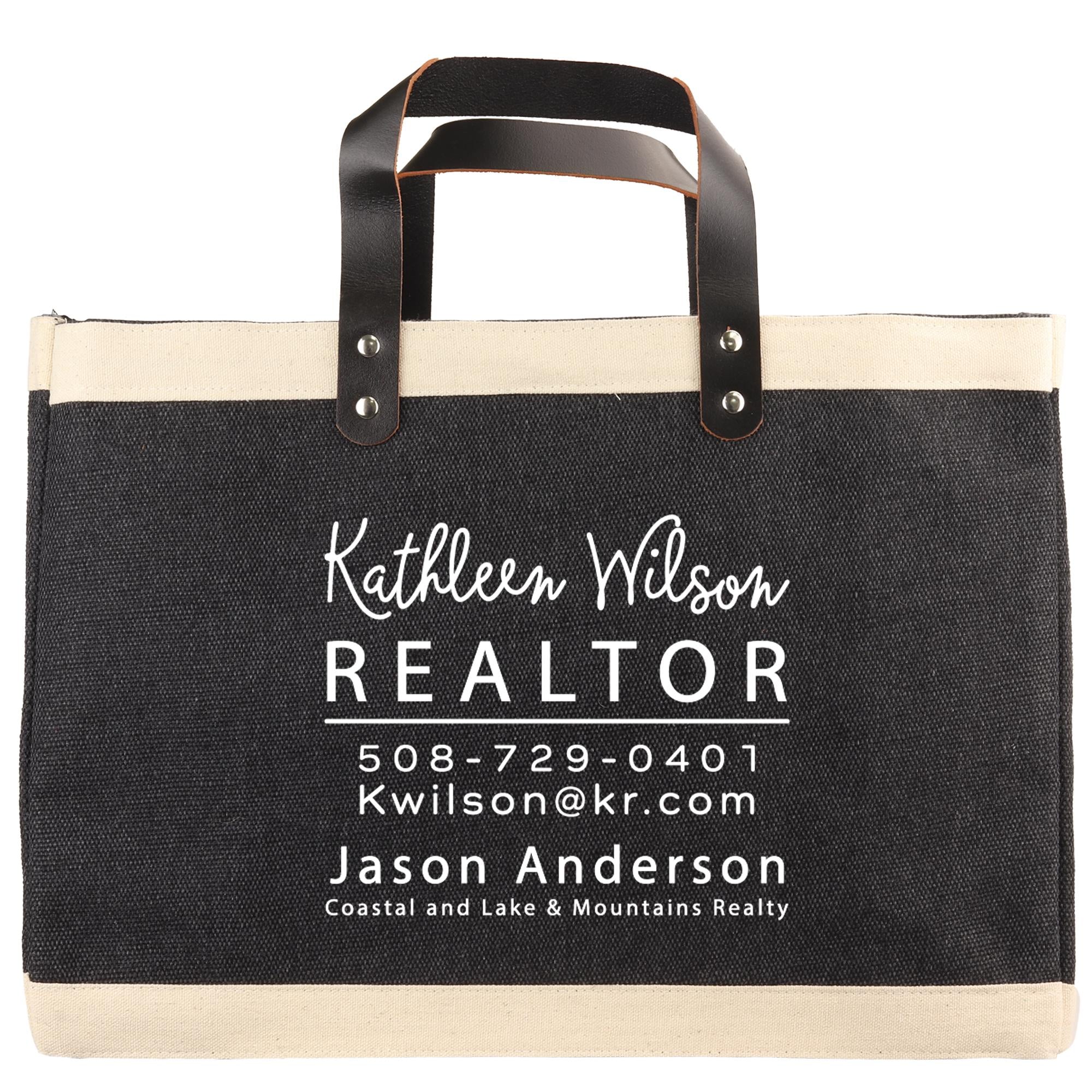 A black and beige tote bag with white text printed on it.